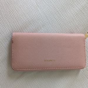 NWOT Pink wallet Amazon brand and came part of a 3 piece purse bundle never used